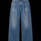 Light blue wide-leg denim jeans with a high waist and front pleats, shown flat against a solid black background.