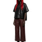 A model with long red hair wearing a black leather short-sleeve top and dark brown wide-leg leather pants, paired with black boots and sunglasses, against a plain white background.