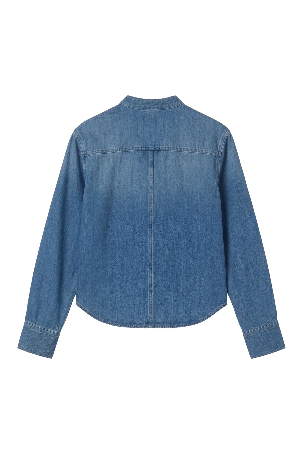 A blue denim long-sleeve shirt shown from the back, featuring a curved hem and button closure at the back neck, displayed on a solid white background.