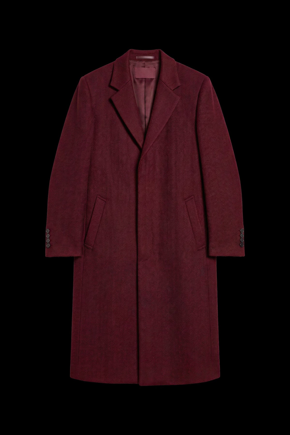 A long burgundy wool-blend coat with notch lapels, front closure, and side pockets, shown against a solid black background.