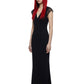 A model with long red hair and black sunglasses wearing a floor-length black dress with sheer cap sleeves, photographed against a plain white background.