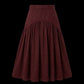 A dark burgundy tiered skirt with a gathered waistband, displayed against a solid black background.