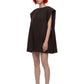 A model with short red hair and black sunglasses wearing a dark brown sleeveless mini dress and black heels, standing against a plain white background.