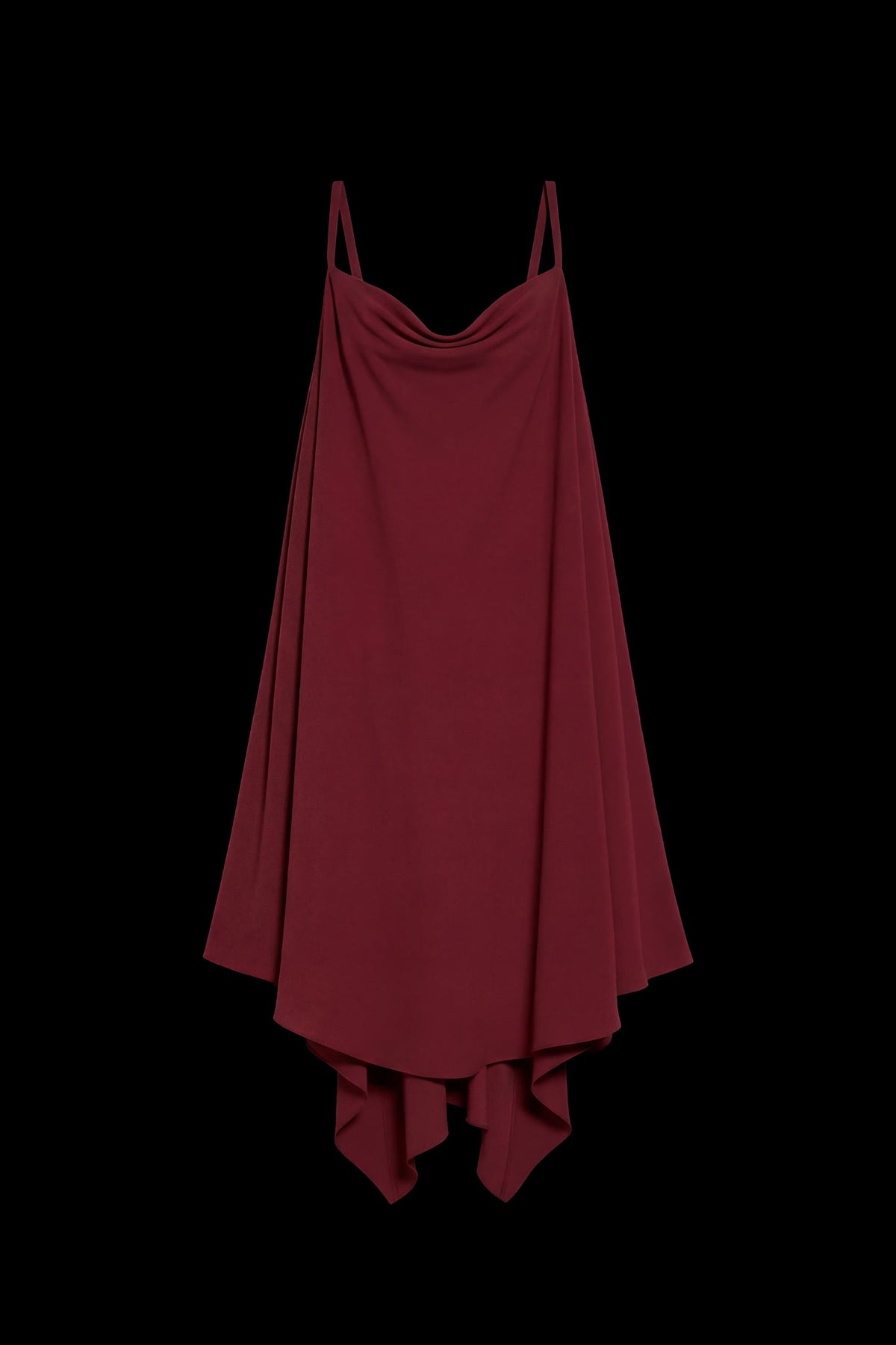 A dark red high-low slip dress with thin spaghetti straps, a draped cowl neckline, and an asymmetrical hemline, shown against a solid black background.