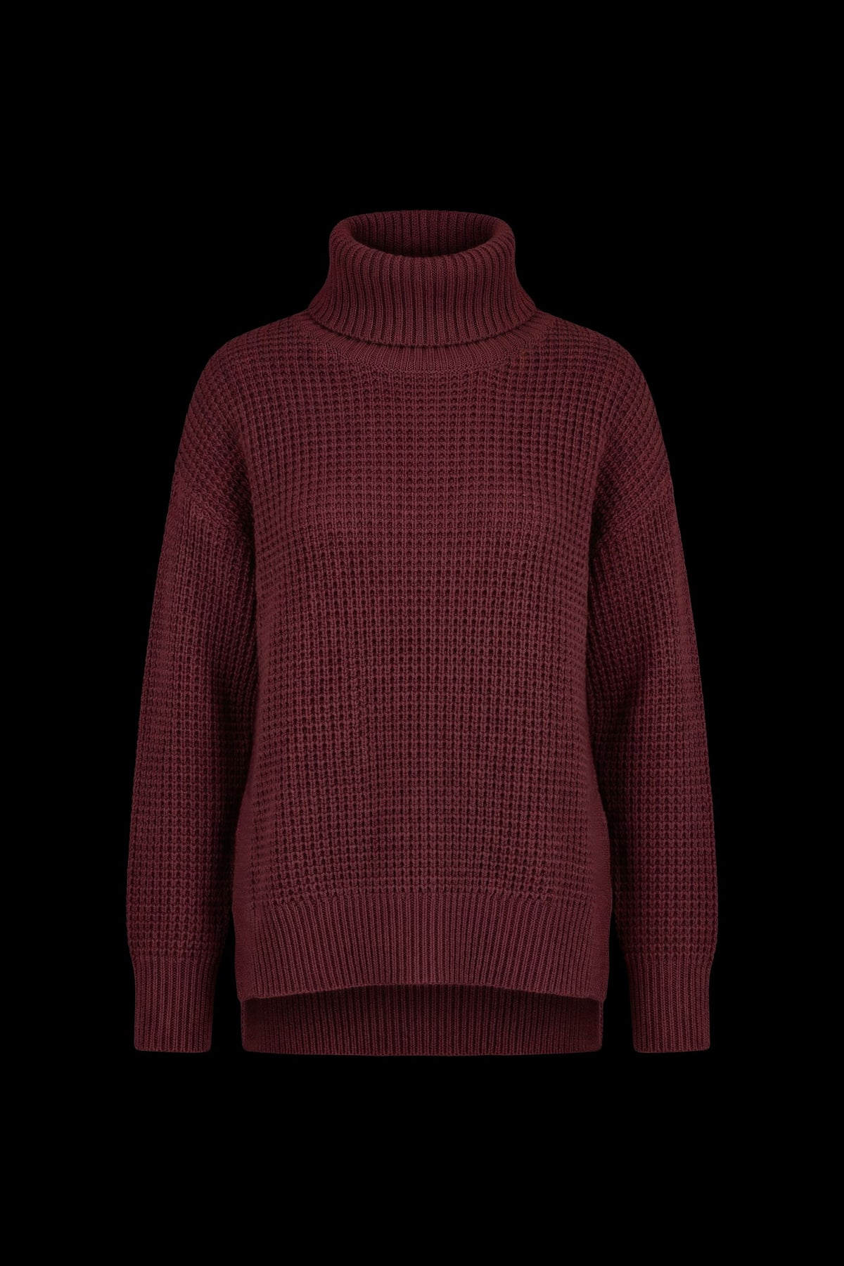 A dark burgundy waffle-knit turtleneck sweater displayed against a solid black background.