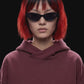 A dark burgundy pullover hoodie with a front kangaroo pocket and subtle tonal side details, displayed against a solid black background.